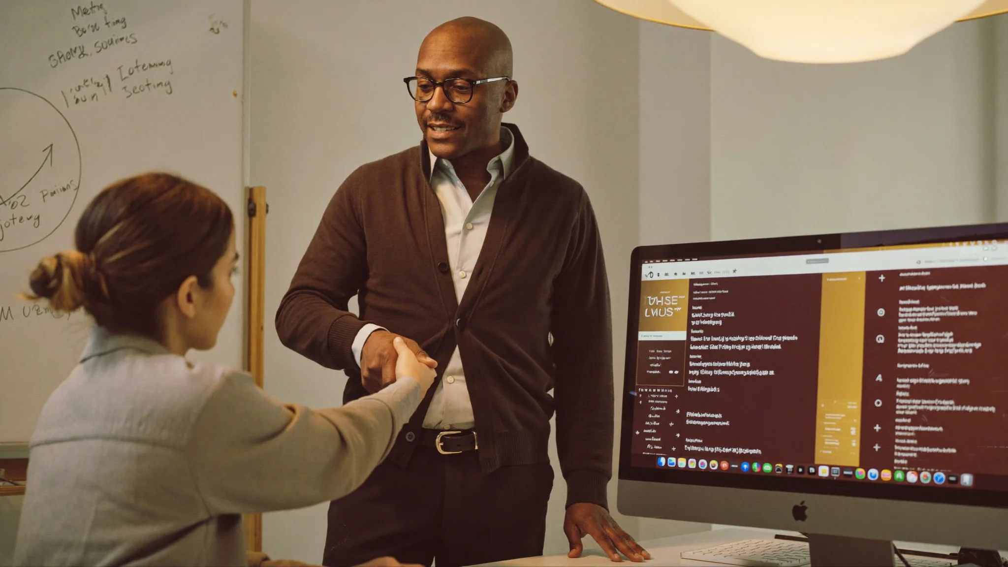 Employee in software training at their Mac with step-by-step on-screen guidance